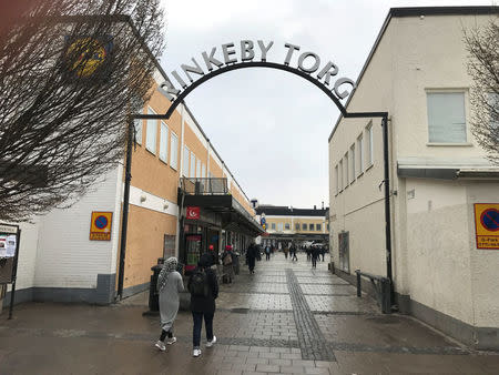 People enter a market in the western suburb of Stockholm, Rinkeby, Sweden, April 10, 2017. Picture taken April 10, 2017. REUTERS/Johan Ahlander