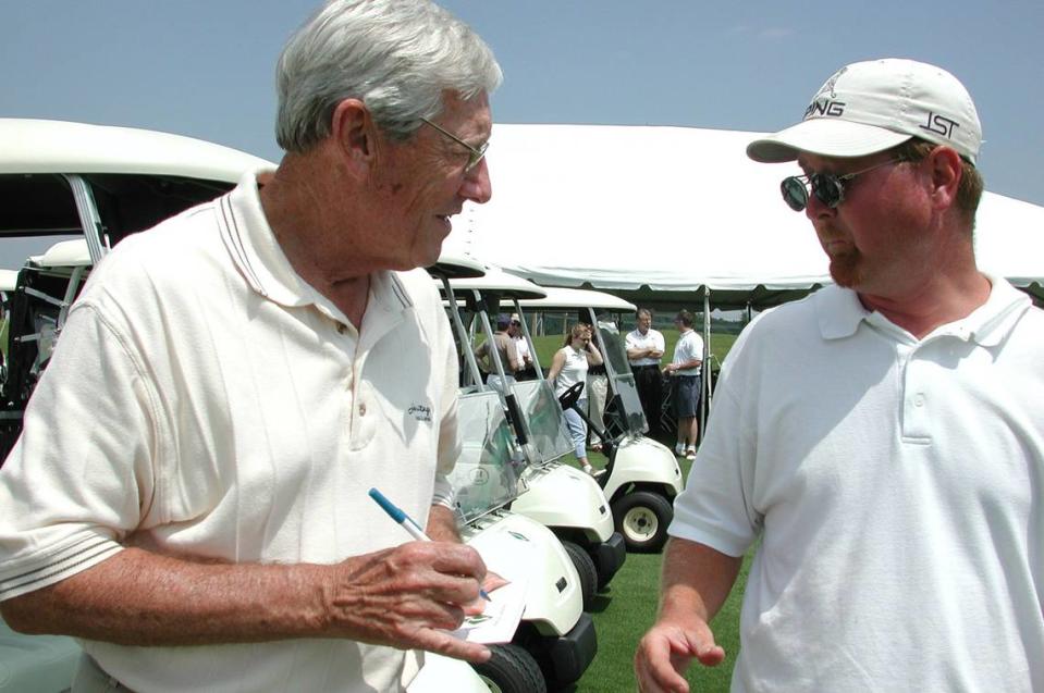 Arthur Hills, designer of Stoneybrook Golf Course at Heritage Harbour, signs an autograph 04/05/2002 for Michael Stilwell prior to the opening of the course. File photo by James A. Jones Jr./jajones1@bradenton.com