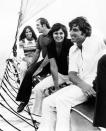 FILE - New York Yankee pitchers Fritz Peterson, front, and Mike Kekich sit on a schooner's bowsprit with their wives, Marilyn Peterson, left, and Susanne Kekich, Aug. 28, 1972, on the Long Island Sound in New York.Peterson, the New York Yankees pitcher who created a controversy when he swapped wives and families with teammate Mike Kekich in 1973, died of lung cancer at his home in Winona, Minn., on Oct. 19, according to the death certificate filed with the Winona County Vital Records Department. He was 81. (AP Photo/Marty Lederhandler, File)