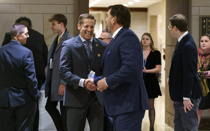 Rep.-elect Rich McCormick (R-Ga.) greets Rep.-elect Morgan Luttrell (R-Texas) before the first session of the New Member Orientation