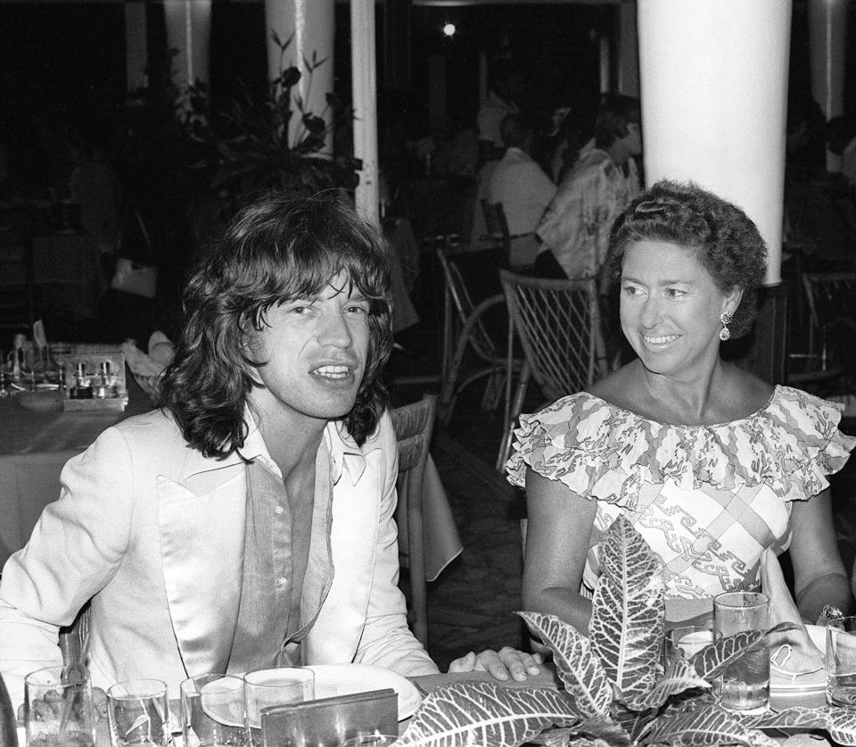 Princess Margaret chats in a restaurant in Pointe-du-Bout, French West Indies, with Rolling Stone rocker Mick Jagger in December 1976.