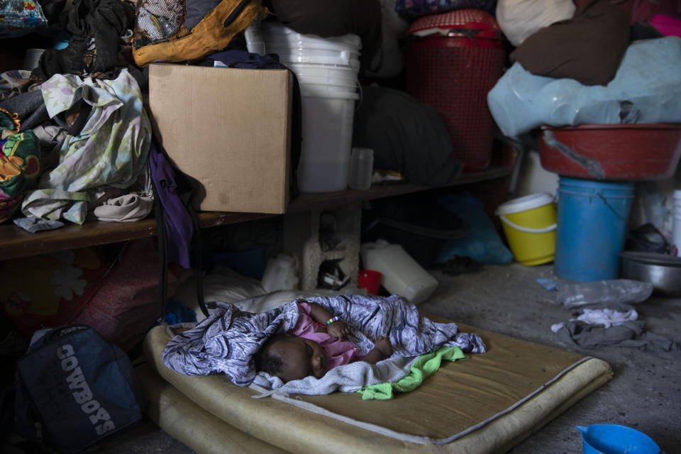 A baby sleeps at a shelter for families displaced by gang violence in Port-au-Prince, Haiti, Thursday, Dec. 9, 2021. According to the United Nations Integrated Office in Haiti, "Rapes, murders, thefts, armed attacks, kidnappings continue to be committed daily, on populations often left to fend for themselves in disadvantaged and marginalized neighborhoods of Port-au-Prince and beyond." (AP Photo/Odelyn Joseph)