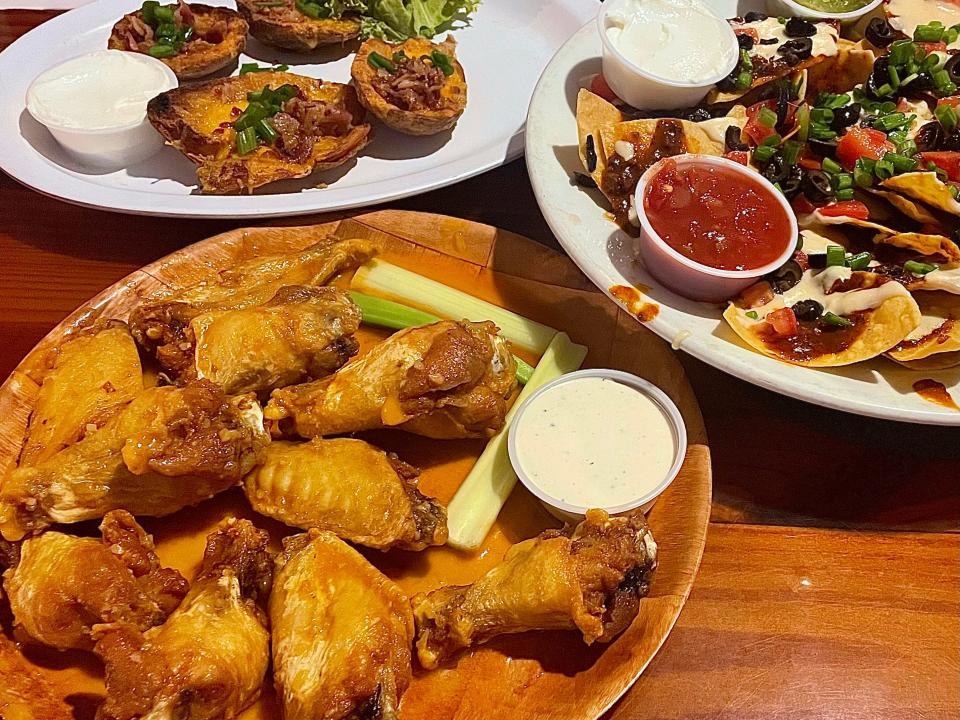 Medium garlic wings, Loaded Chili and Gouda Cheese Nachos and potato skins from McKenna's Place.