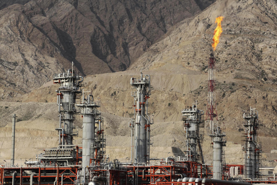 This picture taken on Wednesday, Jan. 22, 2014, shows a gas refinery at the South Pars gas field on the northern coast of Persian Gulf in Asalouyeh, Iran. With a six-month deal in place easing sanctions as Iran negotiates a final deal with world powers, the government hopes to draw international investment to the natural gas field to spur its production. (AP Photo/Vahid Salemi)