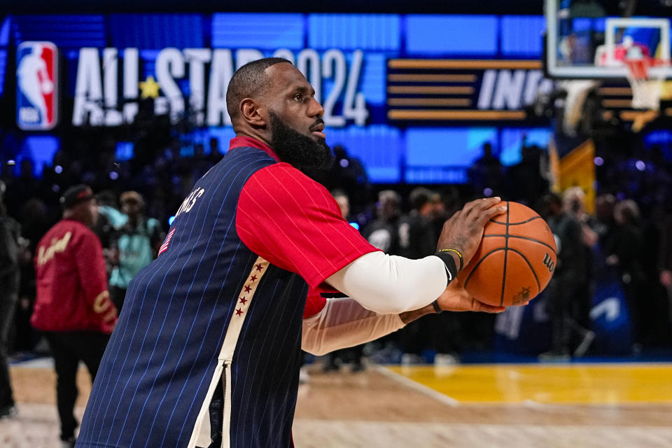 Los Angeles Lakers forward LeBron James (23) warms up before the start of the NBA All-Star basketball game in Indianapolis, Sunday, Feb. 18, 2024. (AP Photo/Darron Cummings)