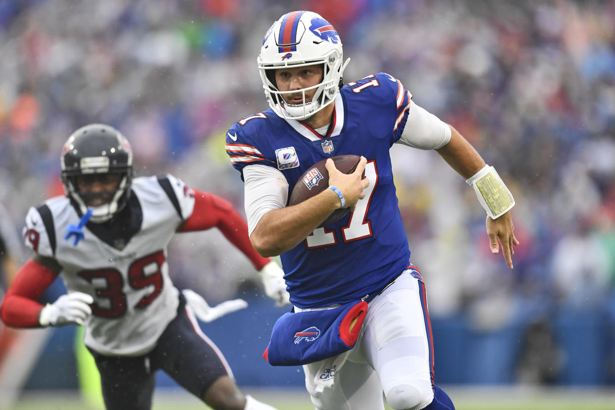 Buffalo Bills quarterback Josh Allen (17) scrambles during the first half of an NFL football game against the Houston Texans, Sunday, Oct. 3, 2021, in Orchard Park, N.Y. (AP Photo/Adrian Kraus)