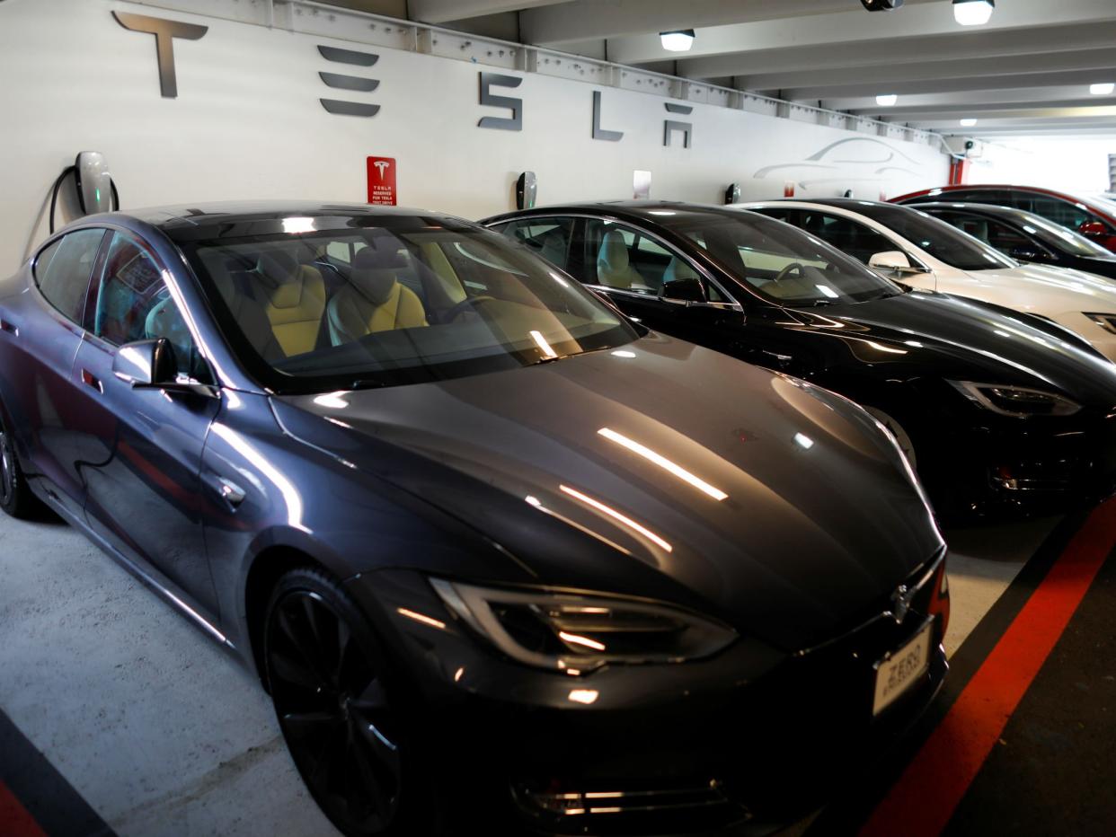 Tesla Model 3s and X's are shown charging in an underground parking lot next to a Tesla store in San Diego, California: REUTERS/Mike Blake