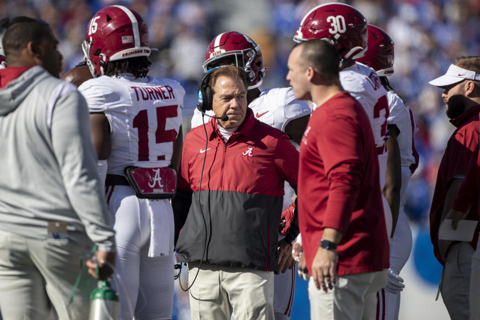 Alabama head coach Nick Saban stands in a huddle during the first half of an NCAA college football game against Kentucky in Lexington, Ky., Saturday, Nov. 11, 2023. (AP Photo/Michelle Haas Hutchins)