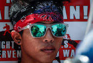 <p>Filipino anti-riot police are reflected on a protester’s sunglasses during a protest in Manila, Philippines, May 17, 2017. The protesters from the group Bayan reiterated its opposition to the US military presence in the Philippines. They are condemning Duterte’s administration in allowing the Philippine and US military exercises to take place, stating that it goes against Duterte’s vow to pursue an independent foreign policy. (Photo: Mark R. Cristino/EPA) </p>