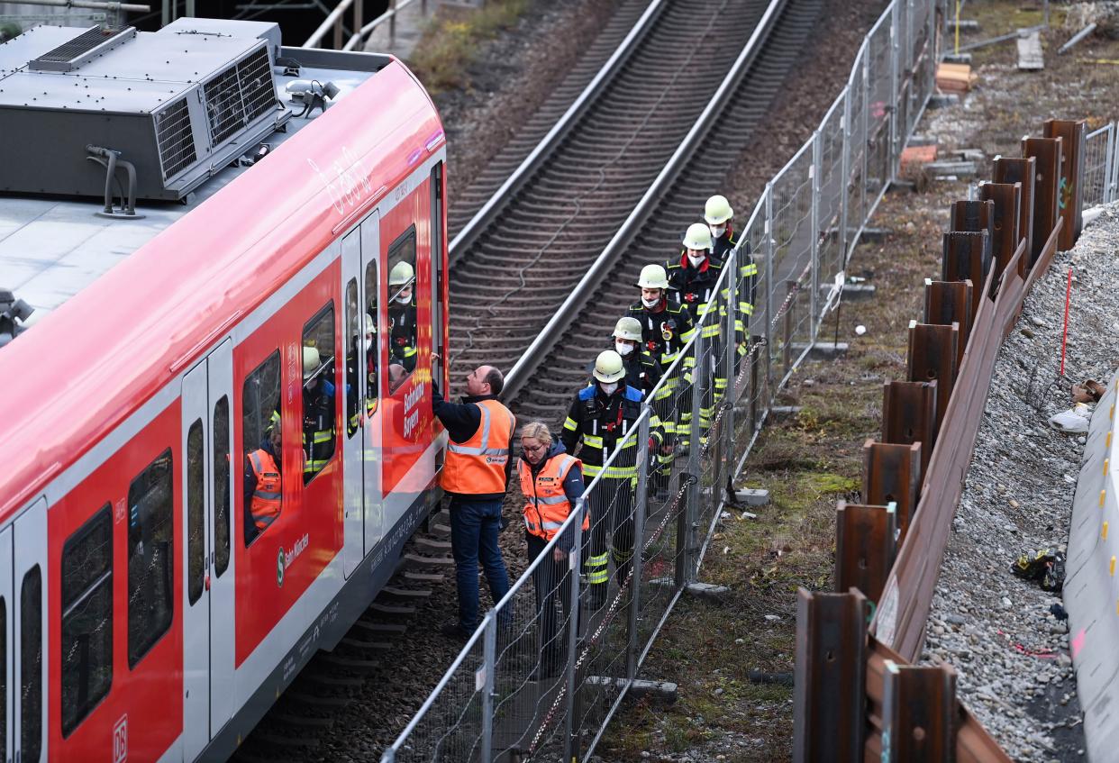 Firefighters at the train station in Munich, Germany, on Wednesday.