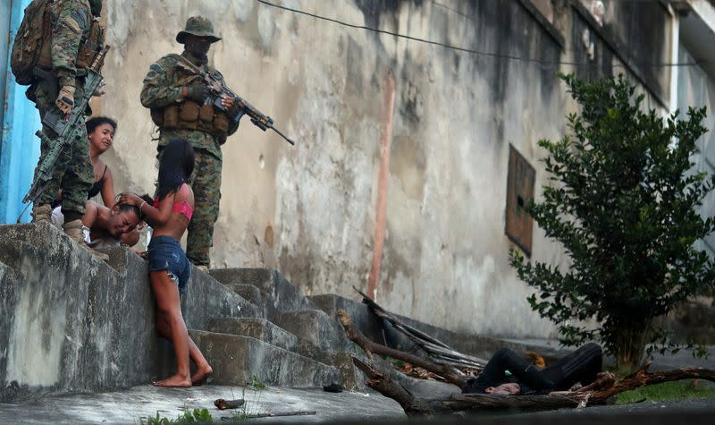 A Picture and its Story: The despair of a Rio widow, in a city struggling with violence