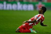 Olympiakos' Costa Rican midfielder Joel Campbell celebrates after scoring during the round of 16 Champions League football match Olympiakos vs Manchester United at Karaiskaki Stadium in Athens on February 25, 2014