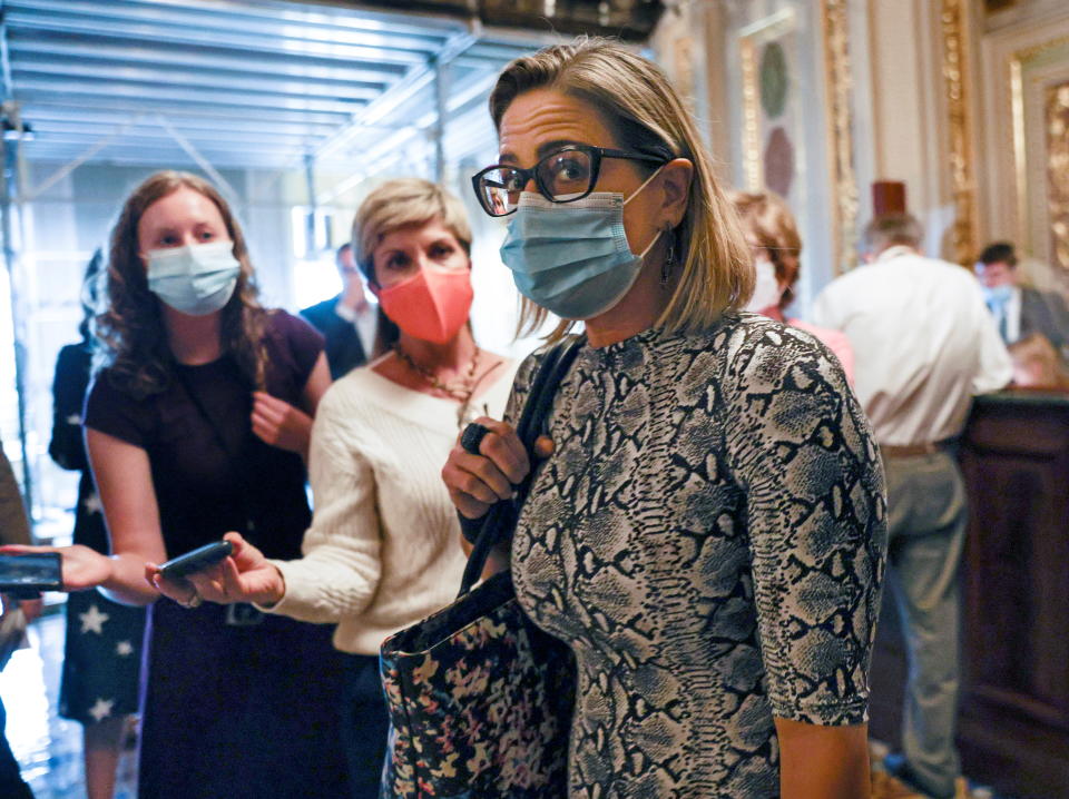 U.S. Senator Kyrsten Sinema departs a meeting of Senate Democrats prior to a delayed vote in the U.S. Senate to suspend the federal government's $28.4 trillion debt ceiling, at the U.S. Capitol in Washington on October 6, 2021.