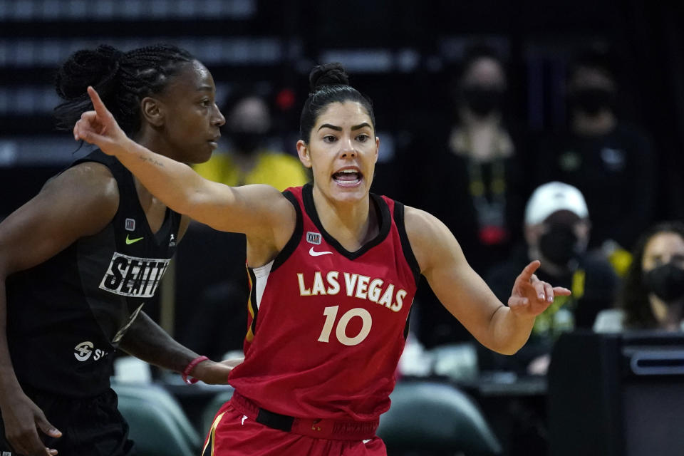 FILE - Las Vegas Aces' Kelsey Plum is shown in action against the Seattle Storm during a WNBA basketball game in Everett, Washington, in this Saturday, May 15, 2021, file photo. Plum is the Sixth Woman of the Year, ending Las Vegas teammate Dearica Hamby's two-year run as the league's top reserve. Plum also earned the Comeback Player of the Year award, announced Wednesday, Sept. 22, 2021.(AP Photo/Elaine Thompson, File)