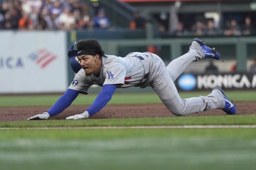 Los Angeles Dodgers' Miguel Vargas steals third base during the second inning of the team's baseball game against the San Francisco Giants in San Francisco, Wednesday, Aug. 3, 2022. (AP Photo/Jeff Chiu)
