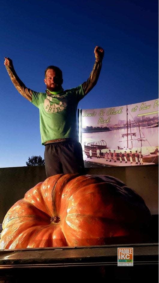 Steve Kueny accompanied by his humongous gourd, Huckleberry before they embarked down the river early Monday morning.