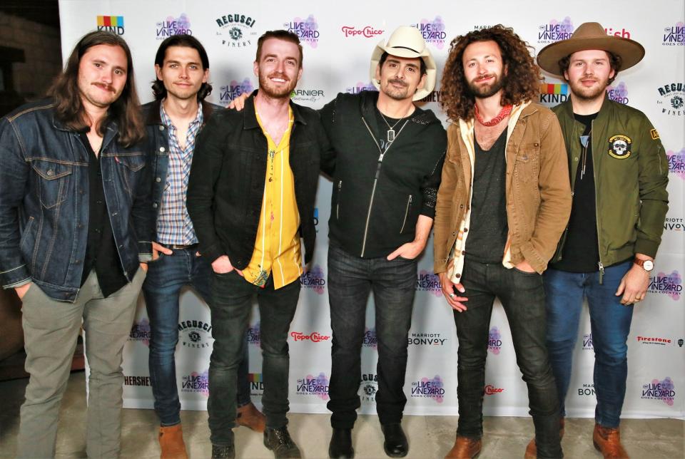 LANCO and Brad Paisley pose at the opening reception, at which they both performed.