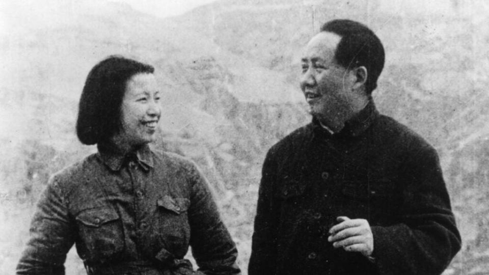 Mao Zedong, first Chairman of the Chinese Communist Party, with his wife, the former Lan Ping, Shanghai motion picture actress, wearing uniform Communist trousers and tunic. As Jiang Qing, she would direct the Party’s early propaganda efforts. (Photo by Fox Photos/Getty Images)