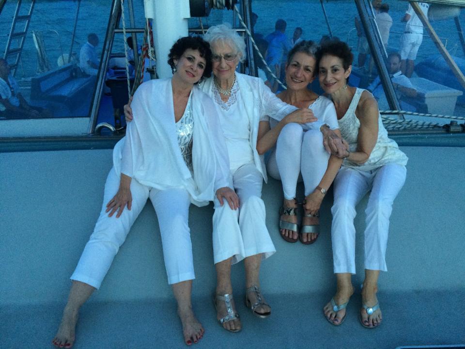 The author (right) with her sisters and mom on a sunset cruise in Bermuda in 2015 for Ilyse's 60th birthday.