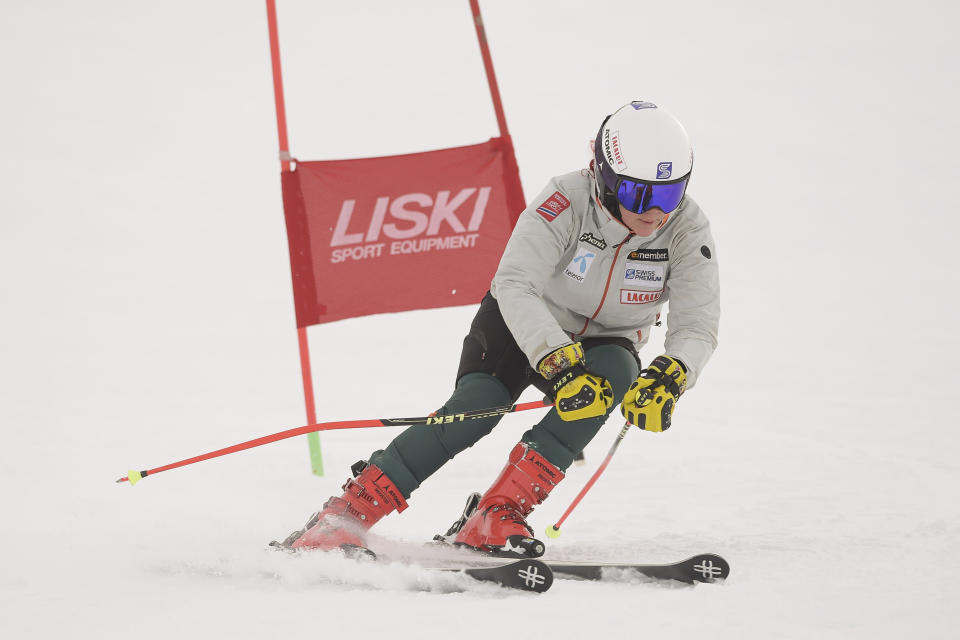 Kiana Kryeziu speeds down the course during training at the Arxhena Ski center in Dragas, Kosovo on Saturday, Jan. 22, 2022. The 17-year-old Kryeziu is the first female athlete from Kosovo at the Olympic Winter Games after she met the required standards, with the last races held in Italy. (AP Photo/Visar Kryeziu)