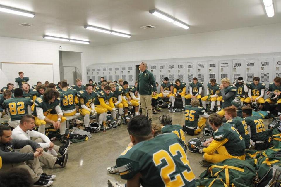 Richland coach Mike Neidhold addresses his team during the Bombers’ 42-10 victory over Central Valley in the Class 4A semifinals in Pasco in 2017.