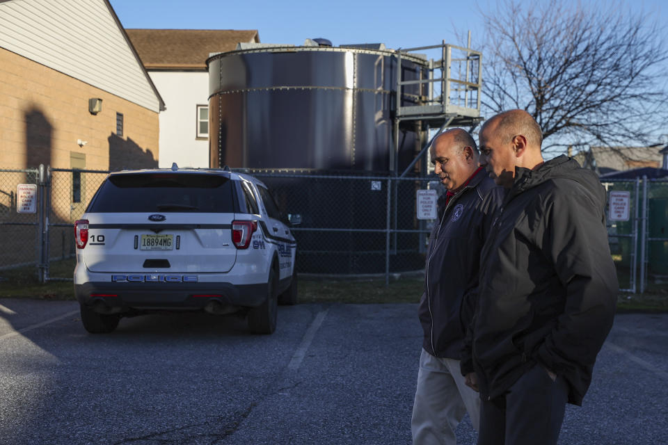 John Giovannitti, left, mayor-elect of Paulsboro, and brother Vince Giovannitti, mayor of Greenwich Township, walk together outside of the Greenwich Township Municipal Building in Gibbstown, N.J., on Tuesday, Dec. 12, 2023. (Heather Khalifa/The Philadelphia Inquirer via AP)