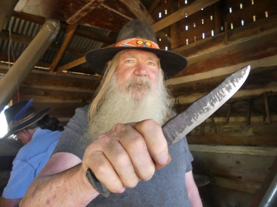 In this file photo, blacksmith Klaus Deubbert, 70, displays a forged knife for a visitor at the Mojave River Valley Museum’s annual Barbecue and Open House. This year's event is on Saturday, May 14 in Barstow.