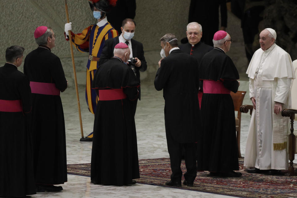 Pope Francis, right, greets bishops at the end of his weekly general audience in the Paul VI hall at the Vatican, Wednesday, Oct. 21, 2020. Pope Francis endorsed same-sex civil unions for the first time as pope while being interviewed for the feature-length documentary “Francesco,” which premiered Wednesday at the Rome Film Festival. (AP Photo/Gregorio Borgia)