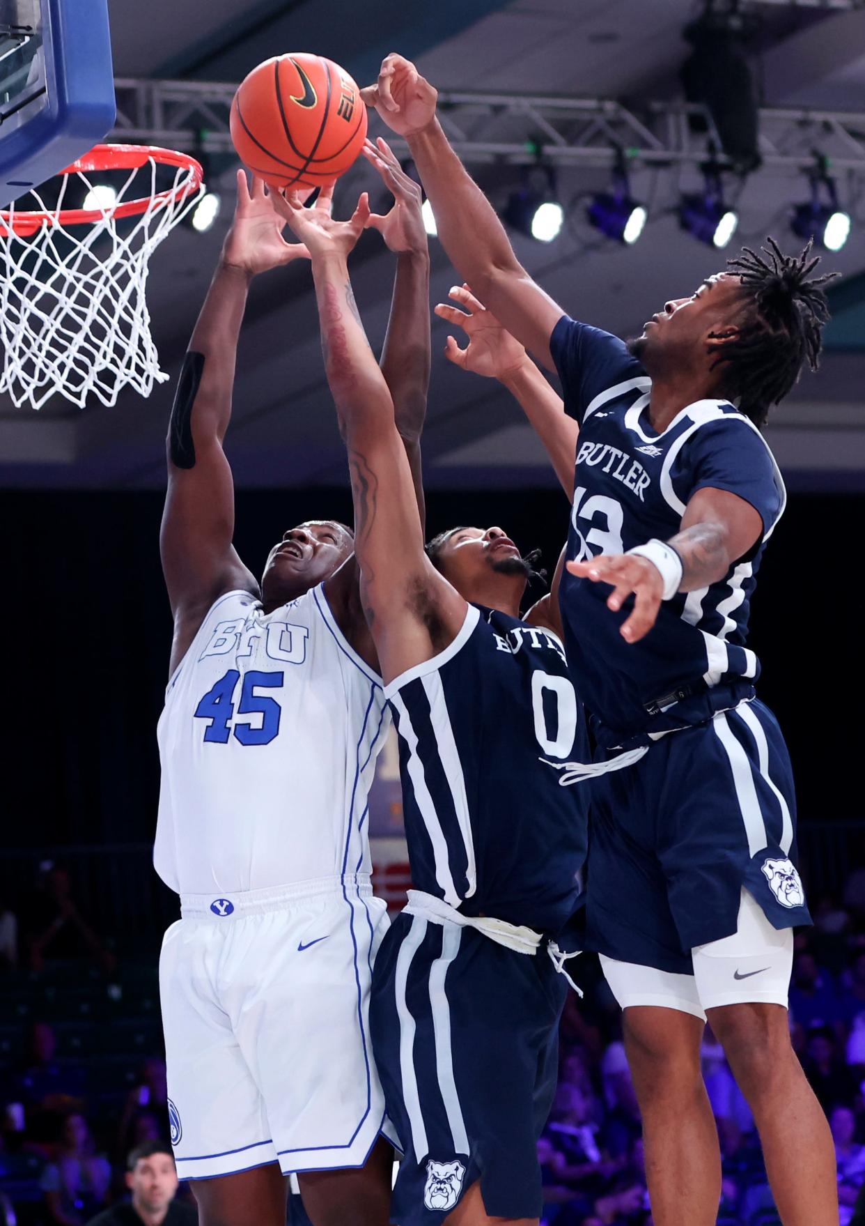 Nov 24, 2022; Paradise Island, BAHAMAS; Brigham Young Cougars forward Fousseyni Traore (45) battles for the ball with Butler Bulldogs forward D.J. Hughes (0) and Butler Bulldogs guard Jayden Taylor (13) during the first half at Imperial Arena. Mandatory Credit: Kevin Jairaj-USA TODAY Sports