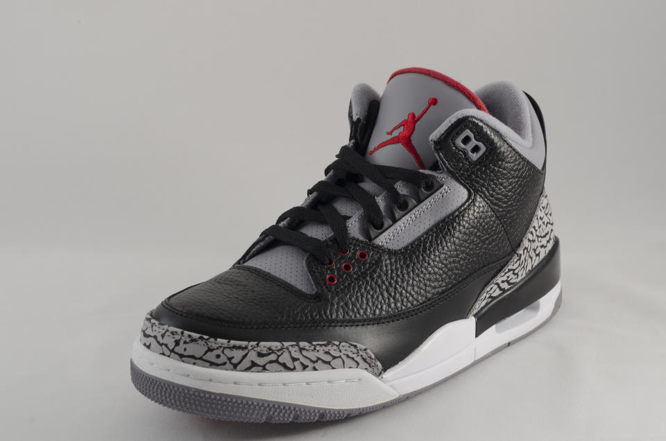 Bergen County New Jersey, USA - September 8, 2013: A Nike Air Jordan III in a black and grey colorway. The Air Jordan 3 was a pivitol release in the Air Jordan sneaker legacy. Said to be Michael Jordan's favorite shoe, this design was the first to feature the "Jumpman" logo and influenced Jordan's decision to stay with Nike. Originally released in 1988, the Air Jordan III was re-released in 1999,2000,2004,2006,2008,and 2012