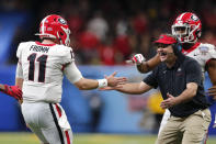 Georgia head coach Kirby Smart greets quarterback Jake Fromm (11) after a touchdown pass in the second half of the Sugar Bowl NCAA college football game against Baylor in New Orleans, Wednesday, Jan. 1, 2020. (AP Photo/Brett Duke)