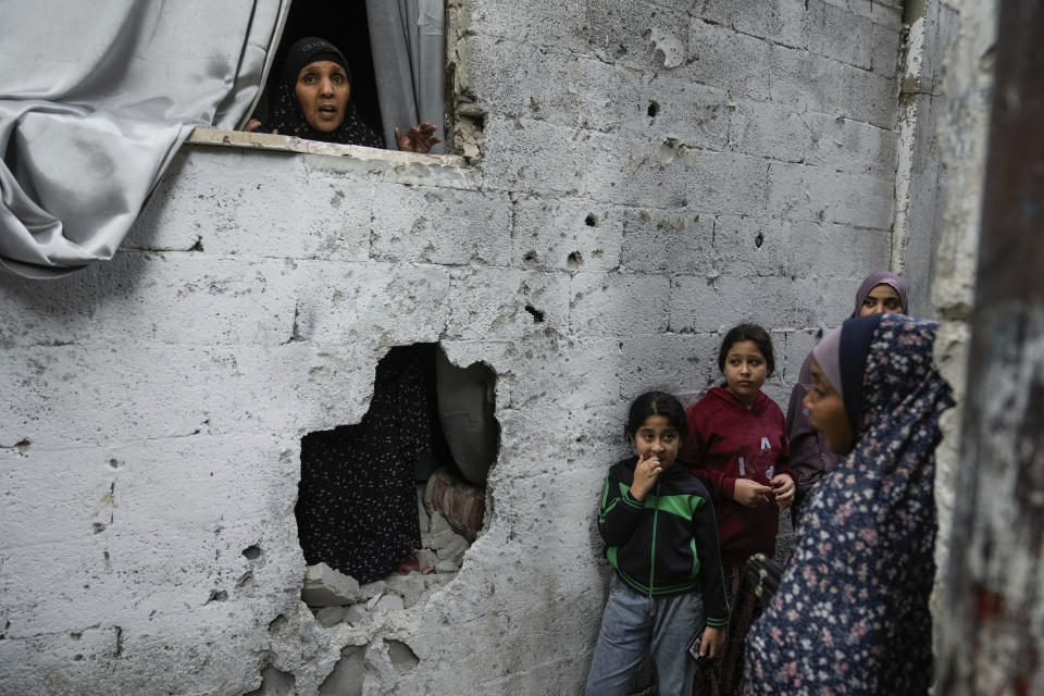 Palestinians inspect the site of an Israeli strike after a military raid in the town of Tulkarem, West Bank, Wednesday, Nov. 22, 2023. The Palestinian Health Ministry said the Israeli military killed six Palestinians, five of them militants, during a raid that sparked an hourslong firefight with militants in a flashpoint refugee camp in the northern city of Tulkarem. (AP Photo/Majdi Mohammed)