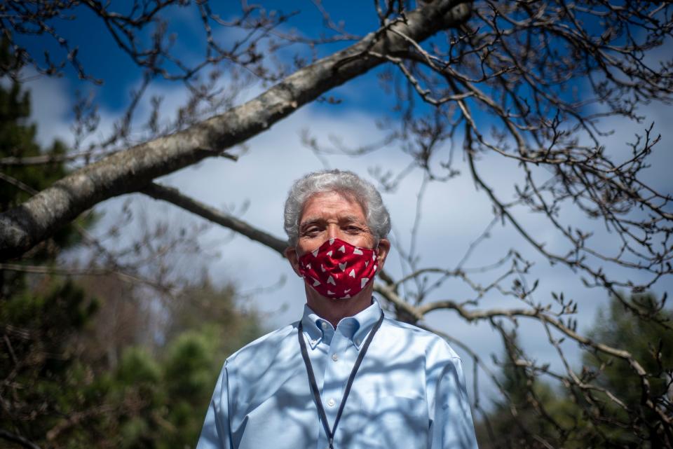 Former York Hospital CEO Jud Knox poses outside his York, Maine home on April 2, 2021. Knox has started a nonprofit, Heart to Heart, which provides free services to seniors in the area.