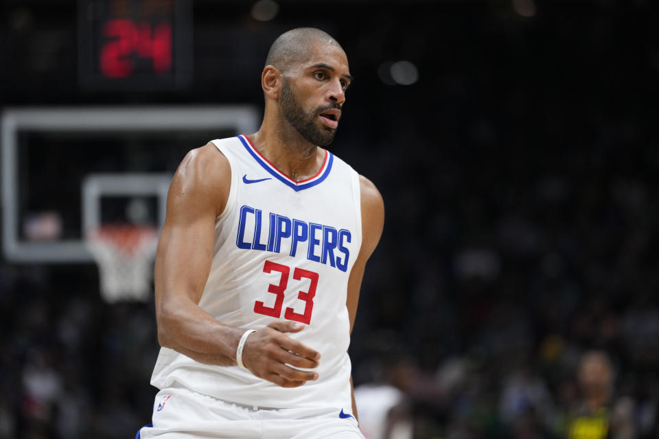 FILE - Los Angeles Clippers forward Nicolas Batum plays the first half of a preseason NBA basketball game against the Utah Jazz, Tuesday, Oct. 10, 2023, in Seattle. James Harden got his trade to the Clippers. The Sixers sent Harden, P.J. Tucker and Filip Petrušev to Los Angeles for Marcus Morris, Robert Covington, Nic Batum, K.J. Martin, a 2028 unprotected first-round pick, two second-round picks, a 2029 draft-pick swap and additional first-rounder from a third team, a person familiar with the trade told The Associated Press Tuesday, Oct. 31.(AP Photo/Lindsey Wasson, File)