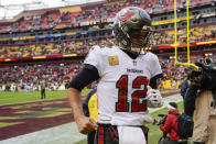 Tampa Bay Buccaneers quarterback Tom Brady jogs off the field after an NFL football game against the Washington Football Team, Sunday, Nov. 14, 2021, in Landover, Md. (AP Photo/Patrick Semansky)