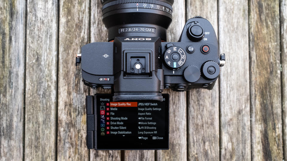 The Sony A7R V on a table from above with screen flipped out