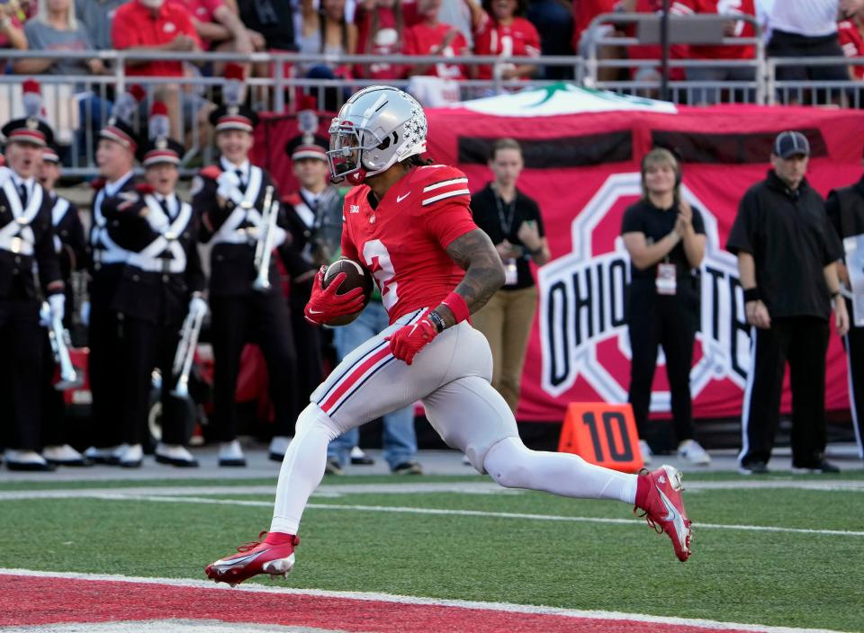 Sep 16, 2023; Columbus, Ohio, USA; Ohio State Buckeyes wide receiver Emeka Egbuka (2) scores a touchdown after a catch against Western Kentucky Hilltoppers during the second quarter of their game at Ohio Stadium.