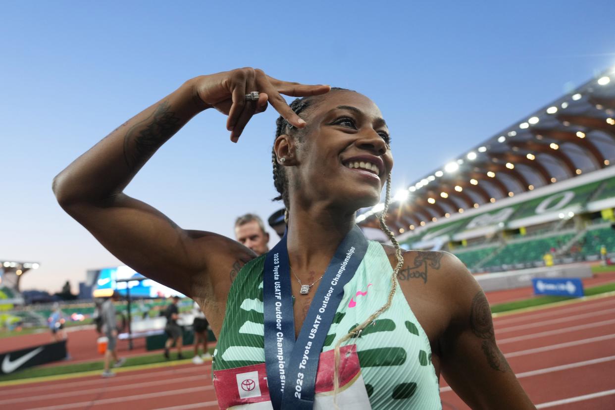 Sha'Carri Richardson celebrates after winning the women's 100 in 10.82 during the USA Track and Field championships.