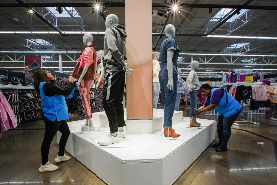 Workers organize mannequins inside the Walmart Supercenter in North Bergen, N.J. on Thursday, Feb. 9, 2023. On Friday, the U.S. government issues the March jobs report. (AP Photo/Eduardo Munoz Alvarez)