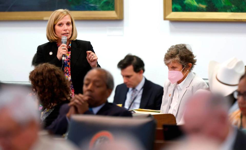 Rep. Sarah Crawford speaks during the floor debate on House Bill 237, the anti-mask and campaign finance bill, in the N.C. House in Raleigh, N.C., Tuesday, June 11, 2024. Rep. Pricey Harrison sits to the right.