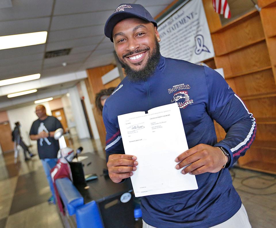 Former Randolph High football standout Fabian Thames, 23, signs a professional rugby contract with the American Raptors in Colorado in front of many Randolph High athletes on Thursday, May 5, 2022.