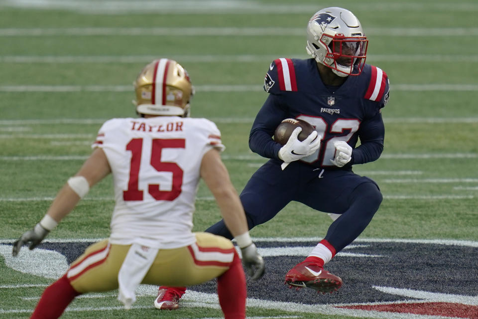 New England Patriots defensive back Devin McCourty, right, runs from San Francisco 49ers wide receiver Trent Taylor (15) after intercepting a pass in the first half of an NFL football game, Sunday, Oct. 25, 2020, in Foxborough, Mass. (AP Photo/Charles Krupa)