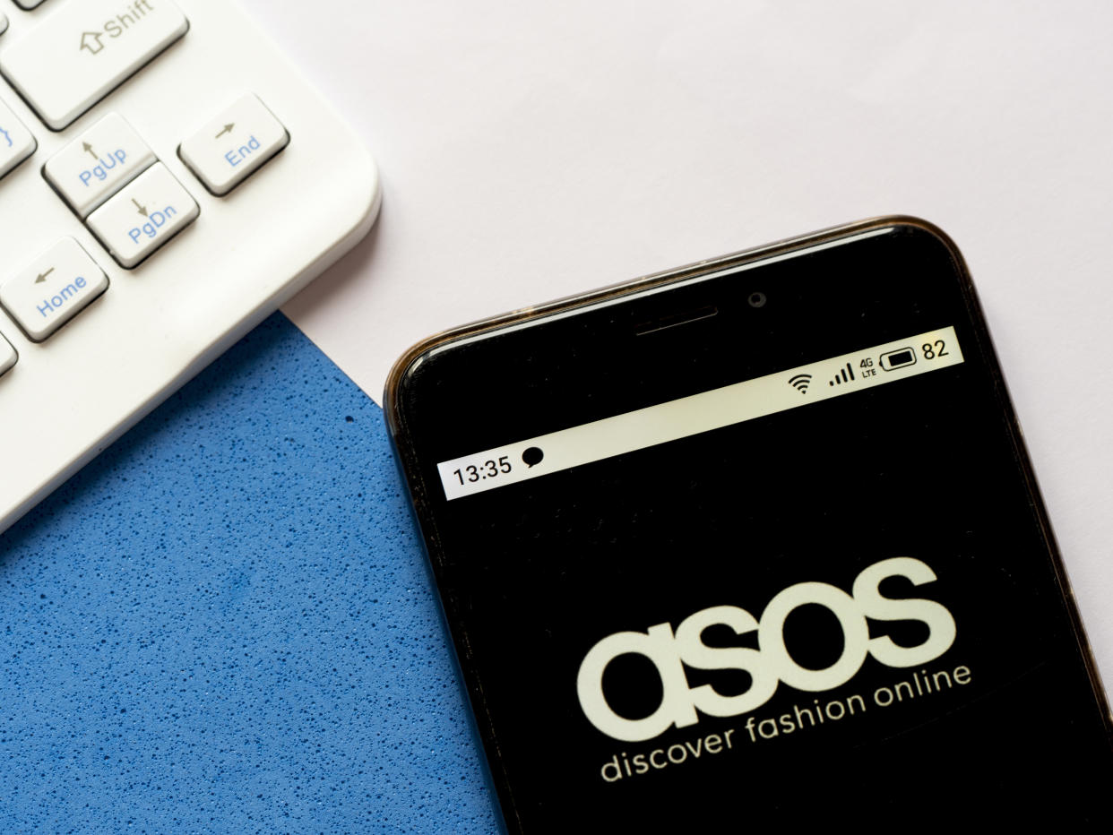 UKRAINE - 2020/04/25: In this photo illustration an Asos logo is seen displayed on a smartphone. (Photo Illustration by Igor Golovniov/SOPA Images/LightRocket via Getty Images)