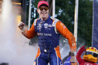 Scott Dixon celebrates after winning the Music City Grand Prix auto race Sunday, Aug. 7, 2022, in Nashville, Tenn. (AP Photo/Mark Humphrey)