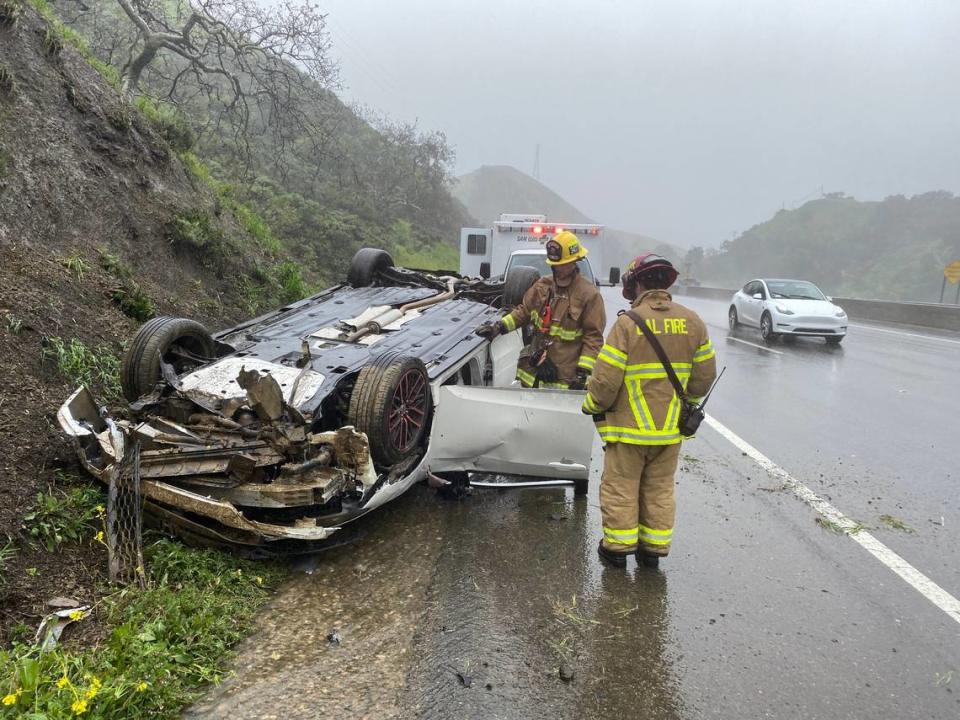 Cal Fire firefighters respond to the scene of a vehicle rollover crash on northbound Highway 101 on the Cuesta Grade on Tuesday, March 14, 2023. David Middlecamp/dmiddlecamp@thetribunenews.com