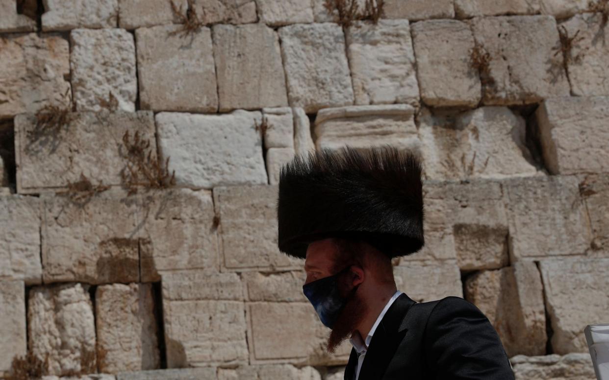 Some members of Israel’s orthodox Jewish community wear fur hats called shtreimels on holidays - Shutterstock