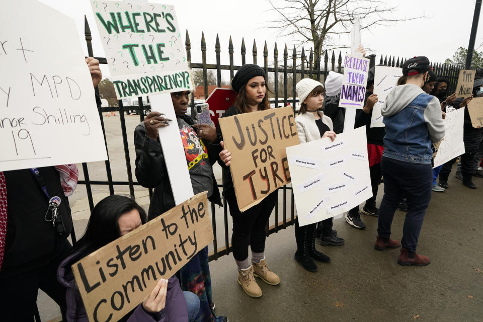 A group of demonstrators protest outside a police precinct in response to the death of Tyre Nichols, who died after being beaten by Memphis police officers, in Memphis, Tenn., Sunday, Jan. 29, 2023. (AP Photo/Gerald Herbert)