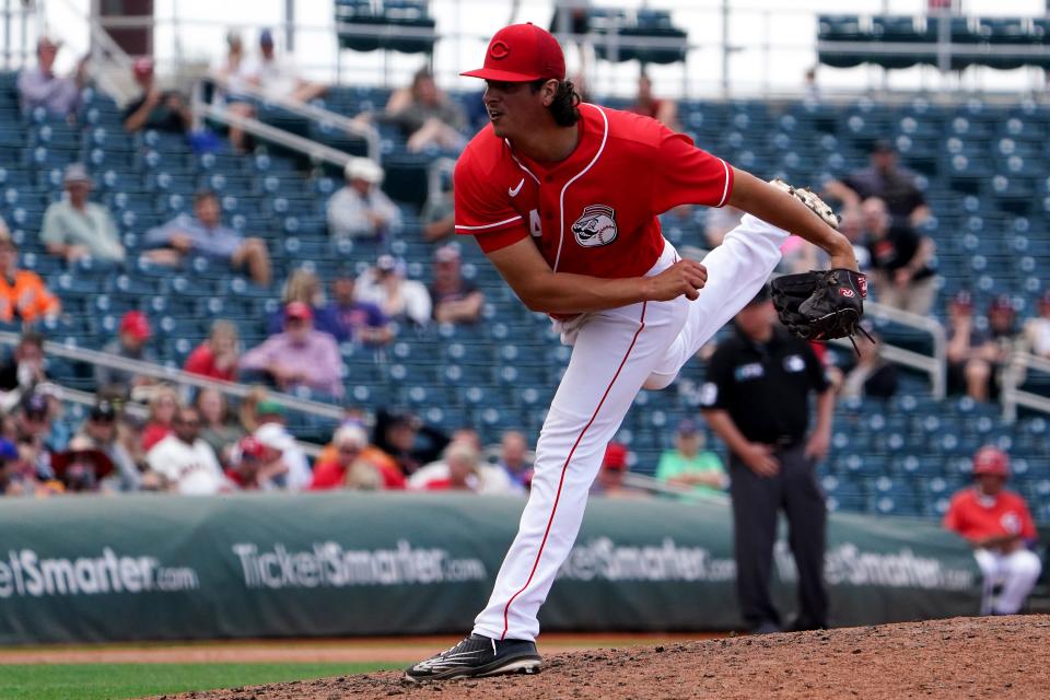 Cincinnati Reds minor league pitcher Vin Timpanelli (34) follows through on a delivery during a spring training game against the San Francisco Giants, Sunday, March 20, 2022, at Goodyear Ballpark in Goodyear, Ariz.