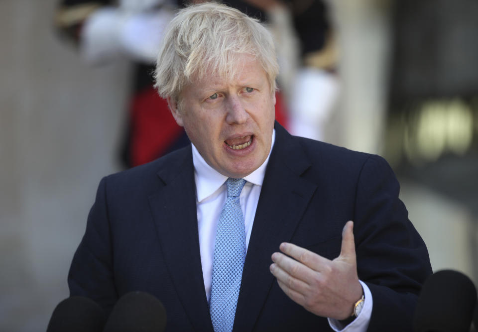 Boris Johnson speaks to the media at the Elysee Palace in Paris on Thursday. (AP)