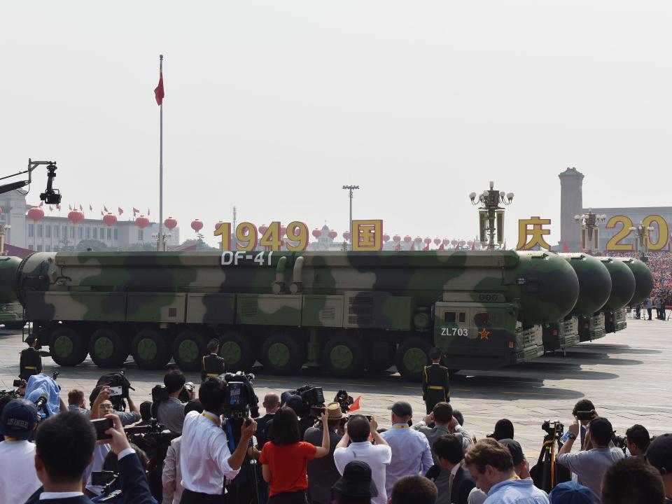 Military vehicles carry China's DF-41 nuclear-capable intercontinental ballistic missiles in a military parade at Tiananmen Square in Beijing on October 1, 2019.